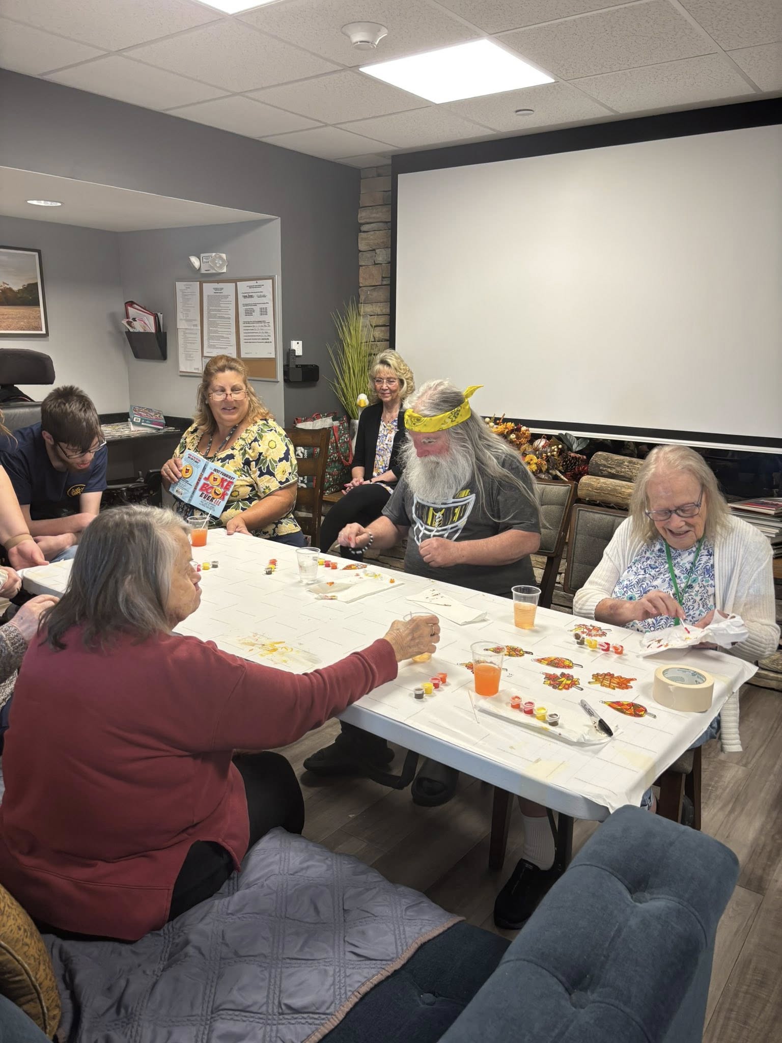a group of seniors working on a craft