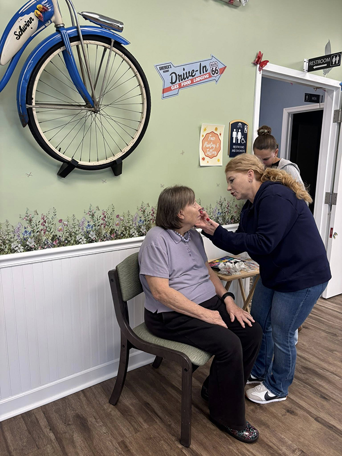 a woman getting makeup done